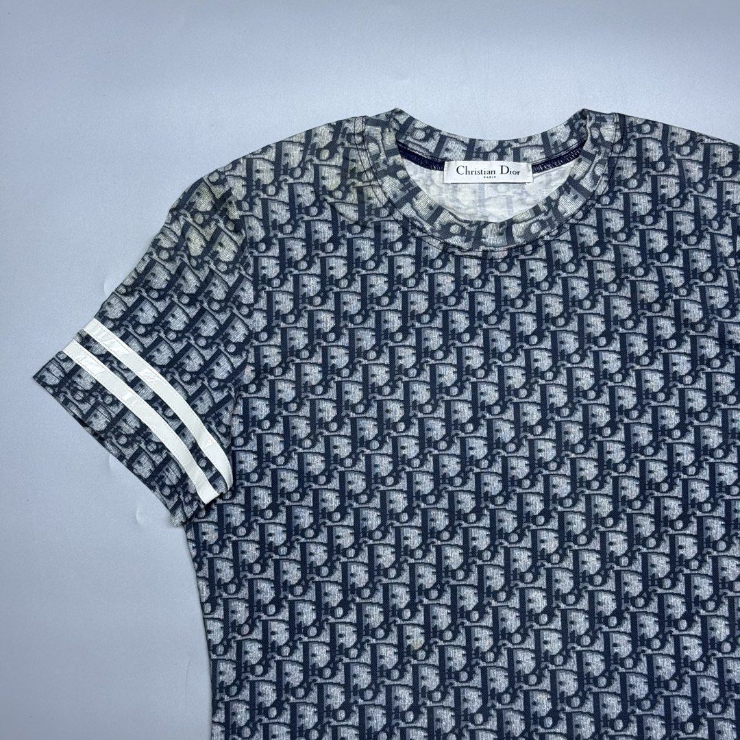 Christian Dior Oblique Monogram (Category: Luxury Apparel) located in Kabacan. Submitted by rags2penny.phl (Listing ID 1468333721, Image 2). Description: - Christian Dior t-shirt in iconic navy blue and white oblique monogram - Size: 40 (Fits true to size) - Material: 90% cotton, 10% polyurethane for a comfortable, structured fit - Design: Short sleeves with sporty double white stripe accents and classic crew neck - Care: Dry clean only (Japanese