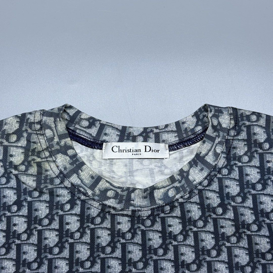 Christian Dior Oblique Monogram (Category: Luxury Apparel) located in Kabacan. Submitted by rags2penny.phl (Listing ID 1468333721, Image 3). Description: - Christian Dior t-shirt in iconic navy blue and white oblique monogram - Size: 40 (Fits true to size) - Material: 90% cotton, 10% polyurethane for a comfortable, structured fit - Design: Short sleeves with sporty double white stripe accents and classic crew neck - Care: Dry clean only (Japanese