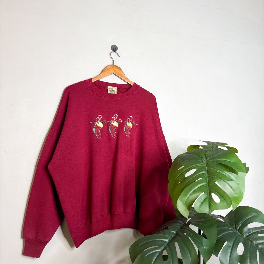 Christmas (Great American) | Sweater. (Category: Coats, Jackets and Outerwear) located in Manila. Submitted by bypiecesandstories (Listing ID 1468324412, Image 1). Description: Christmas (Great American) | Sweater. 699 PHP 🧡 Perfect Condition Wide Vintage Fit Can Fit — Medium to X Large Dimensions — W 29" L 27" A cozy red Christmas sweater with subtle festive graphics on the front. A fun seasonal piece that’s perfect for adding a little holiday 