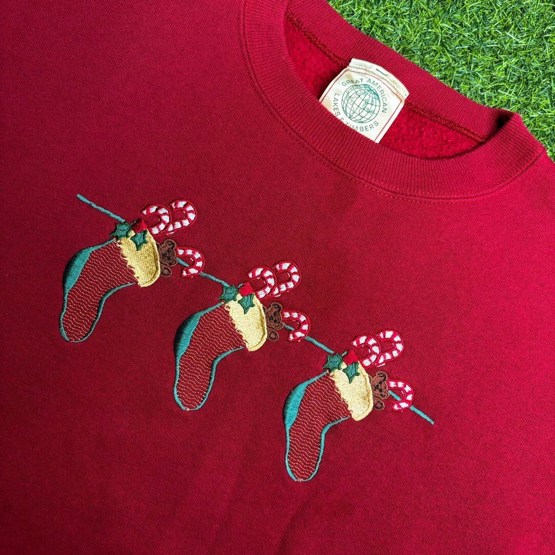 Christmas (Great American) | Sweater. (Category: Coats, Jackets and Outerwear) located in Manila. Submitted by bypiecesandstories (Listing ID 1468324412, Image 3). Description: Christmas (Great American) | Sweater. 699 PHP 🧡 Perfect Condition Wide Vintage Fit Can Fit — Medium to X Large Dimensions — W 29" L 27" A cozy red Christmas sweater with subtle festive graphics on the front. A fun seasonal piece that’s perfect for adding a little holiday 
