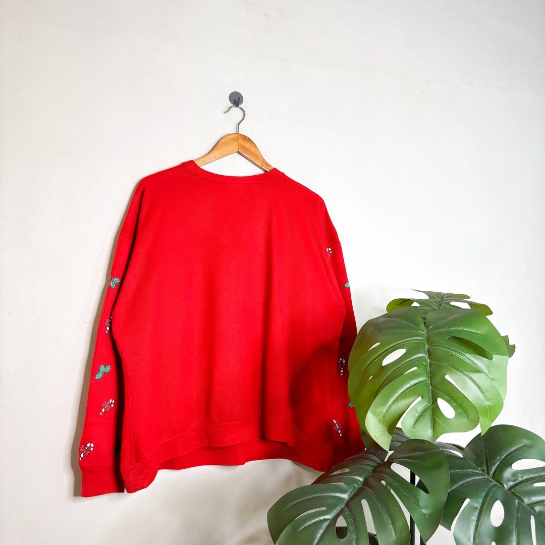 Christmas (Nutcracker) | Sweater. (Category: Coats, Jackets and Outerwear) located in Manila. Submitted by bypiecesandstories (Listing ID 1468324005, Image 2). Description: Christmas (Nutcracker) | Sweater. 699 PHP 🧡 Good Condition Can Fit — Medium to X Large Dimensions — W 26" L 27" A vibrant red Christmas sweater covered in fun, colorful holiday graphics. Perfect for those who love a festive look and want a standout piece for the Christmas sea