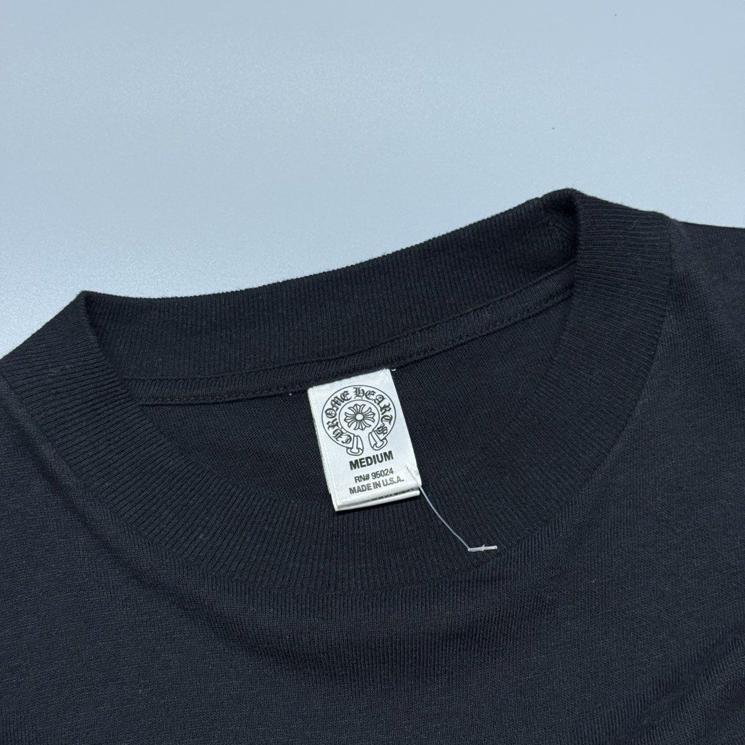 Chrome Hearts Fleur-De-Lis Pocket T-Shirt (Category: Tshirts & Polo Shirts ) located in Kabacan. Submitted by rags2penny.phl (Listing ID 1468339799, Image 3). Description: - Brand: Chrome Hearts - Size: Medium (Made in USA, RN 95024 tags intact) - Color: Solid black cotton with crisp white prints - Front: Chest pocket with white fleur-de-lis print - Back: Large matching fleur-de-lis graphic with smaller motifs - Details: Signature typography prin