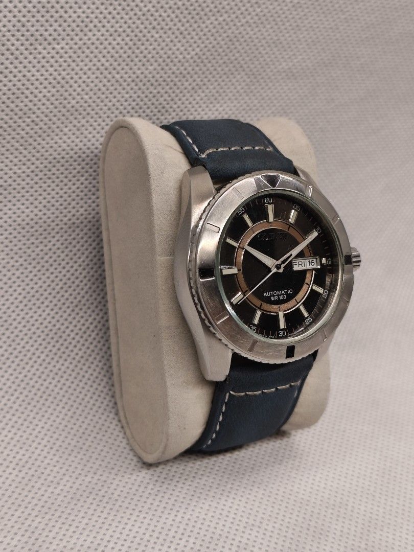 Citizen Automatic reference number NP4000-59F (Category: Men's Watches) located in Pasig City. Submitted by timepiece-and-co (Listing ID 1468399394, Image 2). Description: It features a 21-jewel automatic movement (Caliber 4150), a distinct textured black dial accented by an inner copper/bronze-colored ring, and 100 meters of water resistance (WR 100). While it originally came on a stainless steel bracelet, the one in your picture has been custom