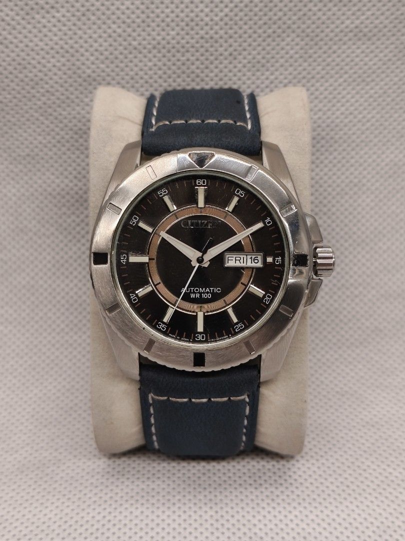 Citizen Automatic reference number NP4000-59F (Category: Men's Watches) located in Pasig City. Submitted by timepiece-and-co (Listing ID 1468399394, Image 1). Description: It features a 21-jewel automatic movement (Caliber 4150), a distinct textured black dial accented by an inner copper/bronze-colored ring, and 100 meters of water resistance (WR 100). While it originally came on a stainless steel bracelet, the one in your picture has been custom