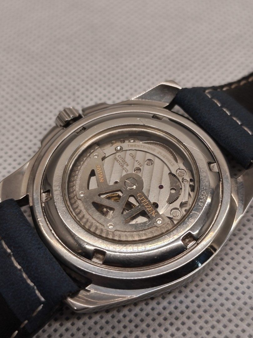 Citizen Automatic reference number NP4000-59F (Category: Men's Watches) located in Pasig City. Submitted by timepiece-and-co (Listing ID 1468399394, Image 3). Description: It features a 21-jewel automatic movement (Caliber 4150), a distinct textured black dial accented by an inner copper/bronze-colored ring, and 100 meters of water resistance (WR 100). While it originally came on a stainless steel bracelet, the one in your picture has been custom