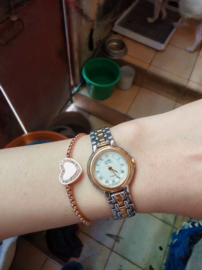 Citizen Club La Mer Two-Tone Watch (Category: Women's Watches) located in Taguig. Submitted by mystuff4youph (Listing ID 1468366111, Image 3). Description: - Brand: Citizen Club La Mer - Type: Women's classic dress wristwatch - Design: Two-tone silver and gold metal strap - Dial: White dial with elegant Roman numerals - Case: Round base metal case with model numbers stamped on the back - Features: Water resistant - Condition: Works fine, with bat
