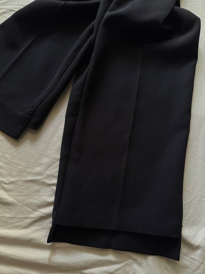 Classic Black Trousers High Waist Tailored Pants (Category: Jeans) located in Mandaluyong City. Submitted by uol77 (Listing ID 1468340702, Image 3). Description: - Color: Black -Length 36inches -Waist 29-30inches - Fit: High waist, straight leg cut - Details: Front pleats, belt loops, sharp front creases, and neat cuff stitching - Pockets: Deep functional side pockets - Style: Versatile for workwear or smart casual looks.
