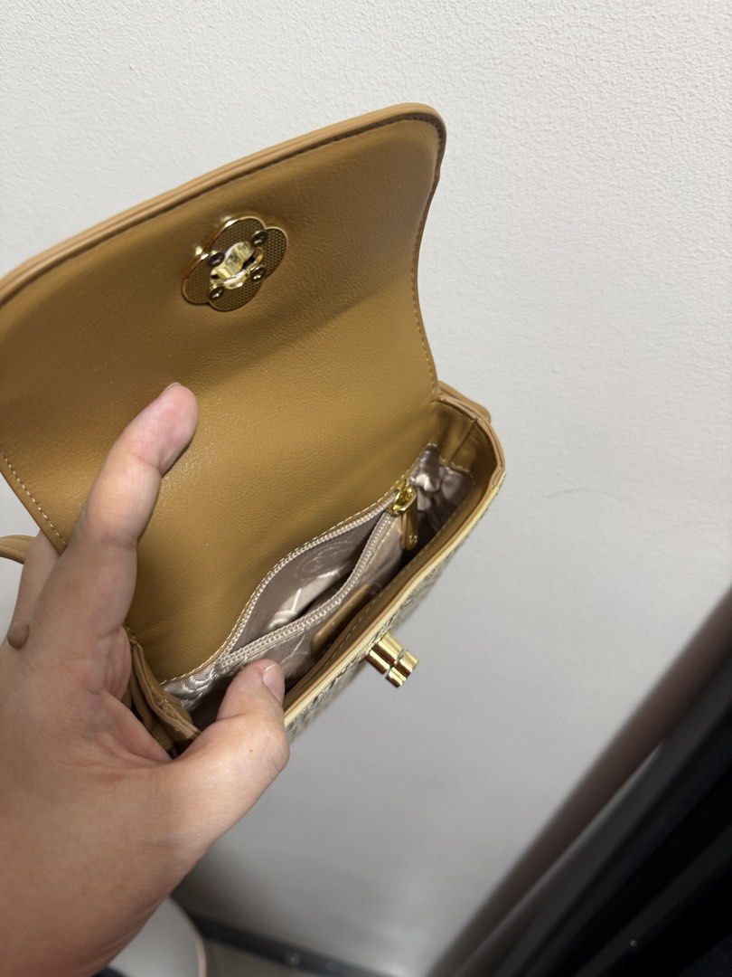 CLN Kathalia Monogram Sling Bag (Category: Cross-body Bags) located in Quezon City. Submitted by czarijay06 (Listing ID 1468355879, Image 3). Description: - Brand: CLN - Style: Kathalia sling bag - Color: Beige and tan with chic woven monogram texture and synthetic leather trim - Hardware: Elegant gold-tone metal clasp closure on the front flap - Interior: Clean lining with one zippered pocket and one slip pocket - Strap: Adjustable shoulder stra