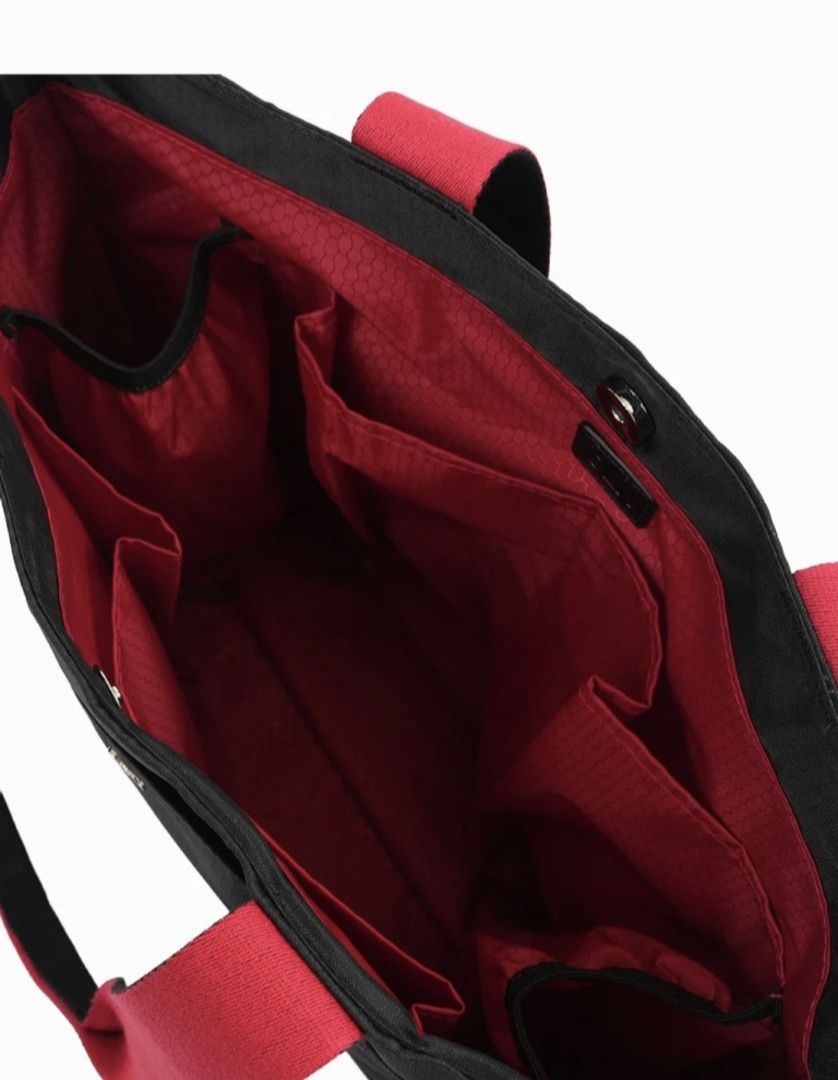 CLN Lacey Tote Bag (Category: Tote Bags) located in Quezon City. Submitted by amai.closet (Listing ID 1468289866, Image 3). Description: - Brand: CLN (Lacey Tote Bag) - Color: Classic black exterior with vibrant red inner lining - Material: Durable fabric construction with sturdy dual shoulder straps - Design: Clean minimalist exterior featuring a small metallic CLN logo plaque - Storage: Multiple organized pockets and spacious compartments for e