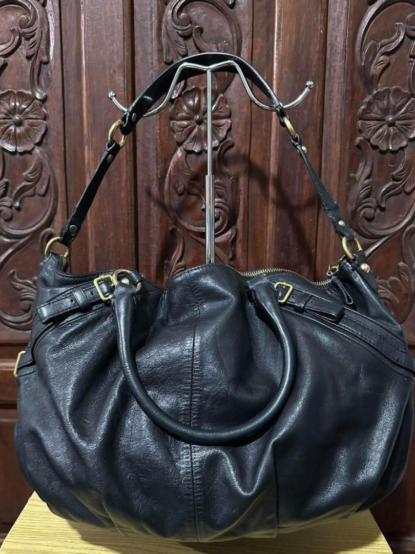 Coach Black Leather Hobo / Shoulder Bag (Category: Luxury Bags & Wallets) located in Pasacao. Submitted by kishhuschka (Listing ID 1466420184, Image 2). Description: - Brand: Coach (Style No. H1026-15955) -Authentic 💯 -Large Size - Material: Super soft black leather with a chic, slouchy shape - Hardware: Gold-tone hardware with front horse and carriage logo stamp - Handles: Double top handles plus an extra handle strap across the back - Closure:
