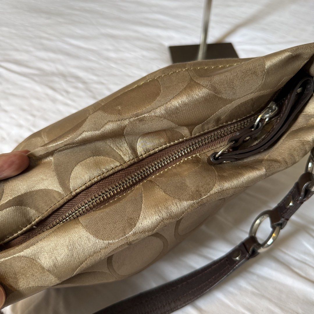 Coach Carly Medium (Category: Luxury Bags & Wallets) located in Naga. Submitted by fynds.fynds (Listing ID 1468316639, Image 3). Description: -has minimal signs of use on the corners, light dirt/stain on the trim, and a minor rubber line issue on the handle. -last price as posted.
