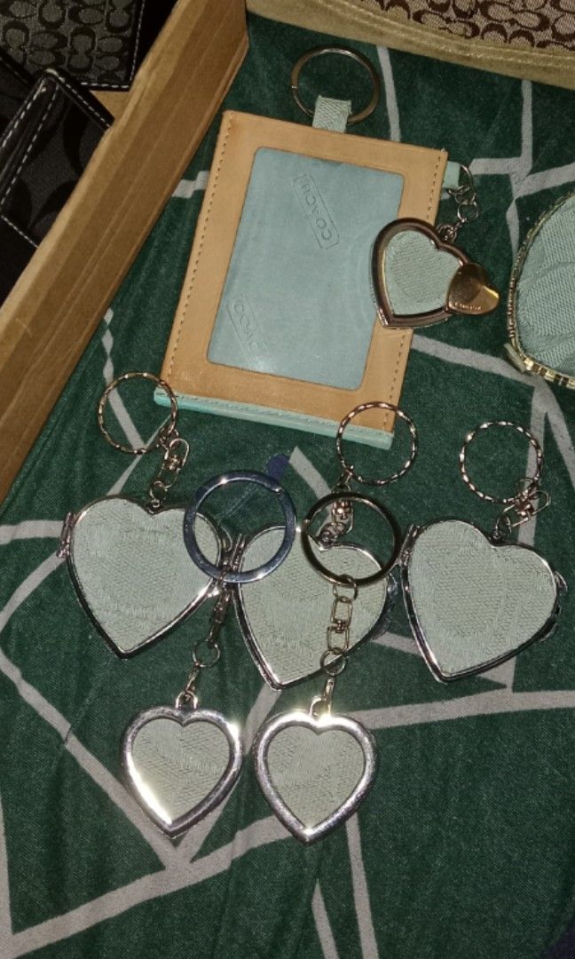 Coach charms (Category: Accessory Holder, Box & Organizers) located in Baguio. Submitted by aurumsie (Listing ID 1468401128, Image 1). Description: DIY cch charms made from authentic coach canvas BIG heart mirror charm keychain - 300 pesos (3 pcs AVAILABLE) small heart keychain - 175 pesos (2 pcs AVAILABLE) Photo charm with double heart - 420 pesos (1 pc AVAILABLE) pls note that this charms are handmade and the material used is from authentic coa