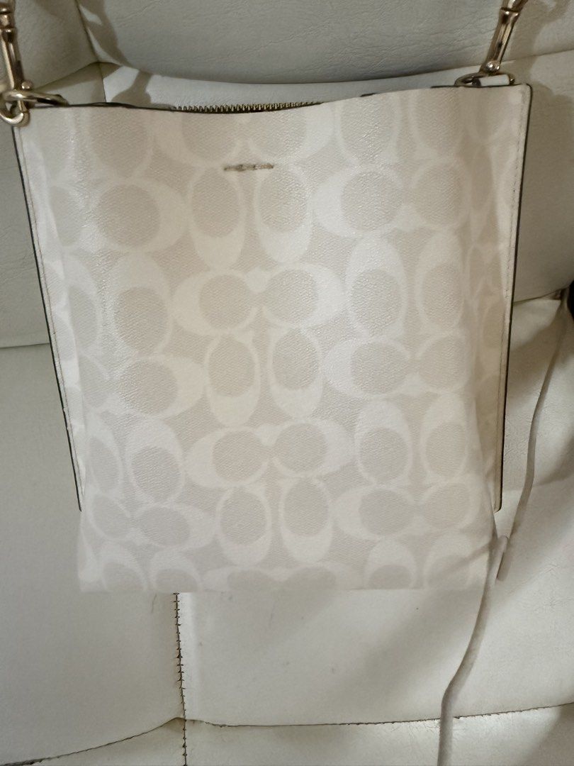 Coach Mollie Bucket Bag 22 (Category: Luxury Bags & Wallets) located in Marikina City. Submitted by maekristine.abadam (Listing ID 1468496830, Image 2). Description: - Authentic Coach mollie 22 in signature white canvas leather - Secure center compartment with zipper closure - Dual open side sections - Adjustable strap with extra long strap included - No inclusion.