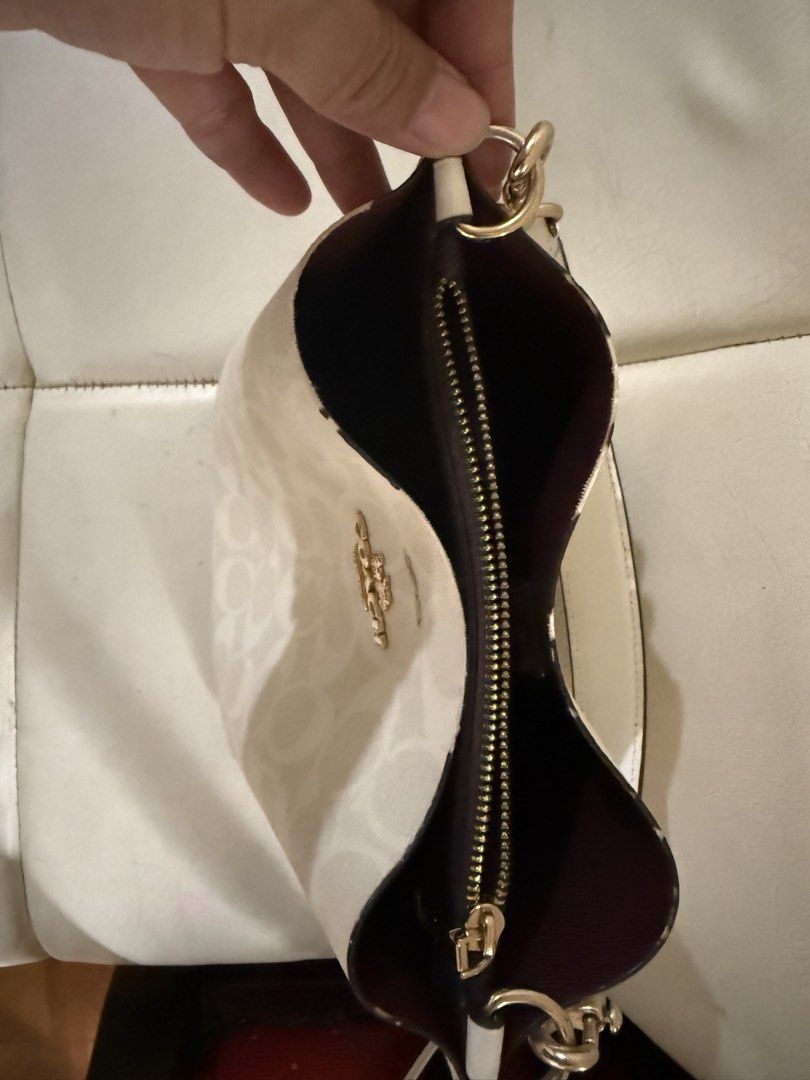 Coach Mollie Bucket Bag 22 (Category: Luxury Bags & Wallets) located in Marikina City. Submitted by maekristine.abadam (Listing ID 1468496830, Image 3). Description: - Authentic Coach mollie 22 in signature white canvas leather - Secure center compartment with zipper closure - Dual open side sections - Adjustable strap with extra long strap included - No inclusion.