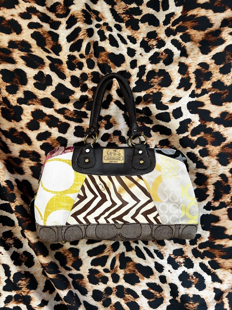 Coach Patchwork Signature Hobo Handbag Multi-pattern Leather (Category: Luxury Bags & Wallets) located in Los Banos. Submitted by samsukehiro (Listing ID 1468380392, Image 1). Description: - Brand: Coach - Style: Patchwork handbag (Signature canvas, zebra print, yellow panels) - Hardware: Gold-tone with front Coach plaque - Handles & Trim: Dark brown leather - Interior: Fabric lining with zip pocket and Coach creed patch - Closure: Top zipper - B