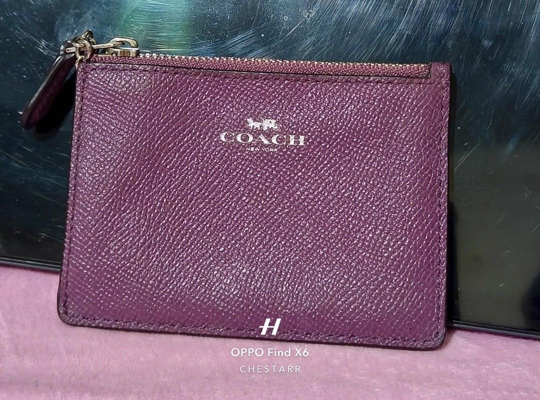 Coach Purple Leather Zip Card Case Wallet (Category: Wallets & Card holders) located in Cauayan City . Submitted by chestarrprelovedauthentic (Listing ID 1468499134, Image 1). Description: - Brand: Coach - Material: Crossgrain leather in purple - Hardware: Silver-tone with embossed Coach New York logo - Storage: Zip top pocket for coins, clear ID window, and multiple card slots - Design: Compact and slim, fits easily in pockets or small bags - Co
