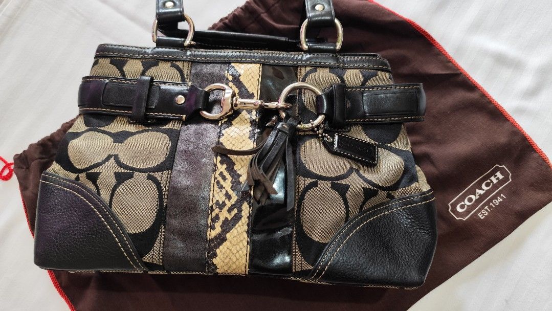 Coach Signature C Op Art Python Mixed Leather Satchel (Category: Luxury Bags & Wallets) located in Malungon. Submitted by 2ndhandoriginals (Listing ID 1468295318, Image 2). Description: - Brand: Coach - Material: Signature C canvas with black leather trim, snakeskin panel, and patent leather stripe - Accents: Tassel charm, dual top handles, zip-top closure - Inclusions: Brown dust bag included - Condition: Shows minor glue discoloration near hard