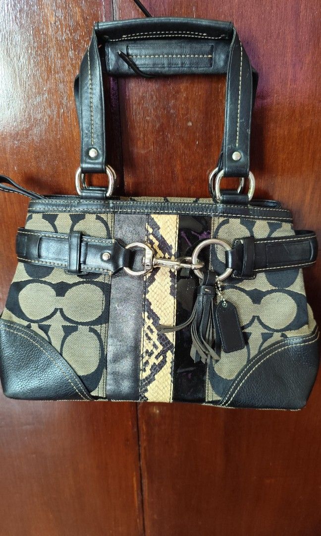Coach Signature C Op Art Python Mixed Leather Satchel (Category: Luxury Bags & Wallets) located in Malungon. Submitted by 2ndhandoriginals (Listing ID 1468295318, Image 1). Description: - Brand: Coach - Material: Signature C canvas with black leather trim, snakeskin panel, and patent leather stripe - Accents: Tassel charm, dual top handles, zip-top closure - Inclusions: Brown dust bag included - Condition: Shows minor glue discoloration near hard