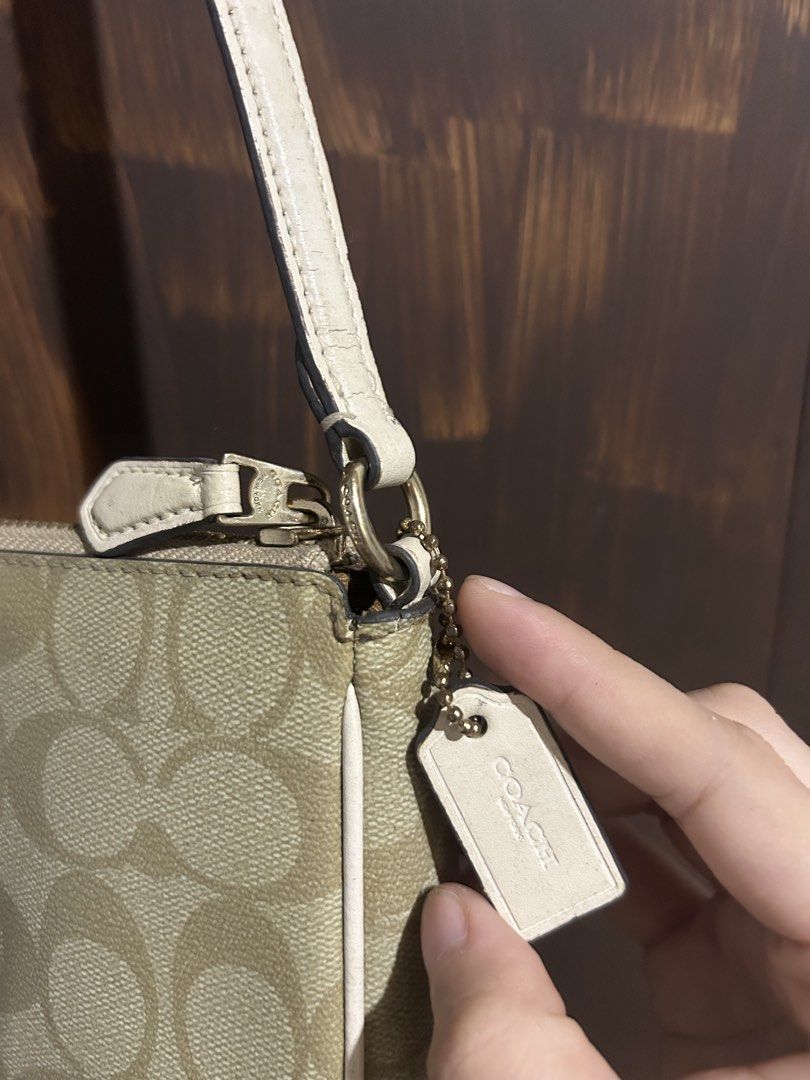 Coach Signature Canvas (Category: Purses & Pouches) located in Balanga. Submitted by coolwhale-76ba (Listing ID 1468307608, Image 2). Description: - classic monogram pattern - Elegant straps featuring oversized faux pearls and gold-tone chain accents - Secure zipper closures to keep your essentials safe - Signature Coach leather hangtags attached to side rings - Compact sizes ideal for daily outings or evening events.