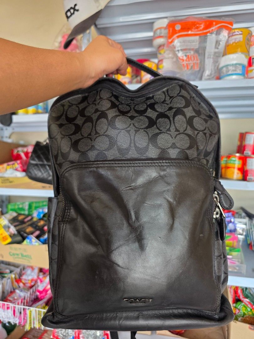 Coach Signature Leather Backpack F33755 (Category: Backpacks) located in Lemery. Submitted by venus23 (Listing ID 1468302882, Image 2). Description: - Coach backpack in classic black leather and signature monogram canvas - Spacious main compartment with a clean interior lining - Convenient front zip pocket for easy access to essentials - Comfortable mesh back padding for all-day wear - Durable leather shoulder straps with sturdy, high-quality har