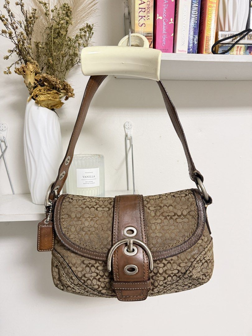 Coach Soho Flap (Category: Shoulder Bags) located in Muntinlupa City. Submitted by carry.ligaya (Listing ID 1468497334, Image 1). Description: * Repainted and has cracks on handle, but all goods in canvas and clean inside. 7/10 ~All charms, designs and extenders are not included. ~Nego konti Note before claiming: All sales are final. No cancellations, exchanges, returns, or refunds (including lay aways). Kindly double-check all item details befor
