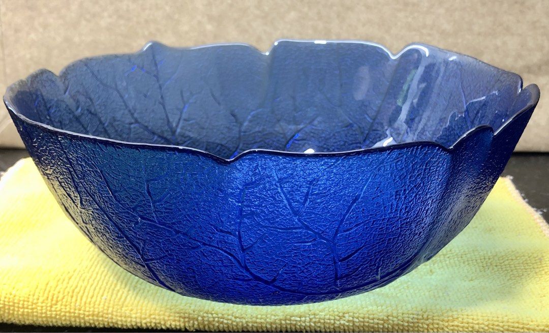 Bowl (Category: Dinnerware & Cutlery) located in Quezon City. Submitted by may.reyes (Listing ID 1468296734, Image 1). Description: Item: Cobalt Blue Glass Leaf Bowl Serving Dish - Striking cobalt blue glass bowl with rich, translucent color - Intricate leaf vein texture molded into both exterior and interior - Elegant scalloped leaf-edge rim and deep round shape - Versatile piece ideal as a dining table centerpiece or fruit bowl.