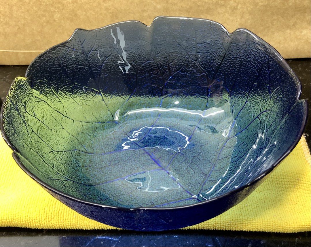 Bowl (Category: Dinnerware & Cutlery) located in Quezon City. Submitted by may.reyes (Listing ID 1468296734, Image 2). Description: Item: Cobalt Blue Glass Leaf Bowl Serving Dish - Striking cobalt blue glass bowl with rich, translucent color - Intricate leaf vein texture molded into both exterior and interior - Elegant scalloped leaf-edge rim and deep round shape - Versatile piece ideal as a dining table centerpiece or fruit bowl.