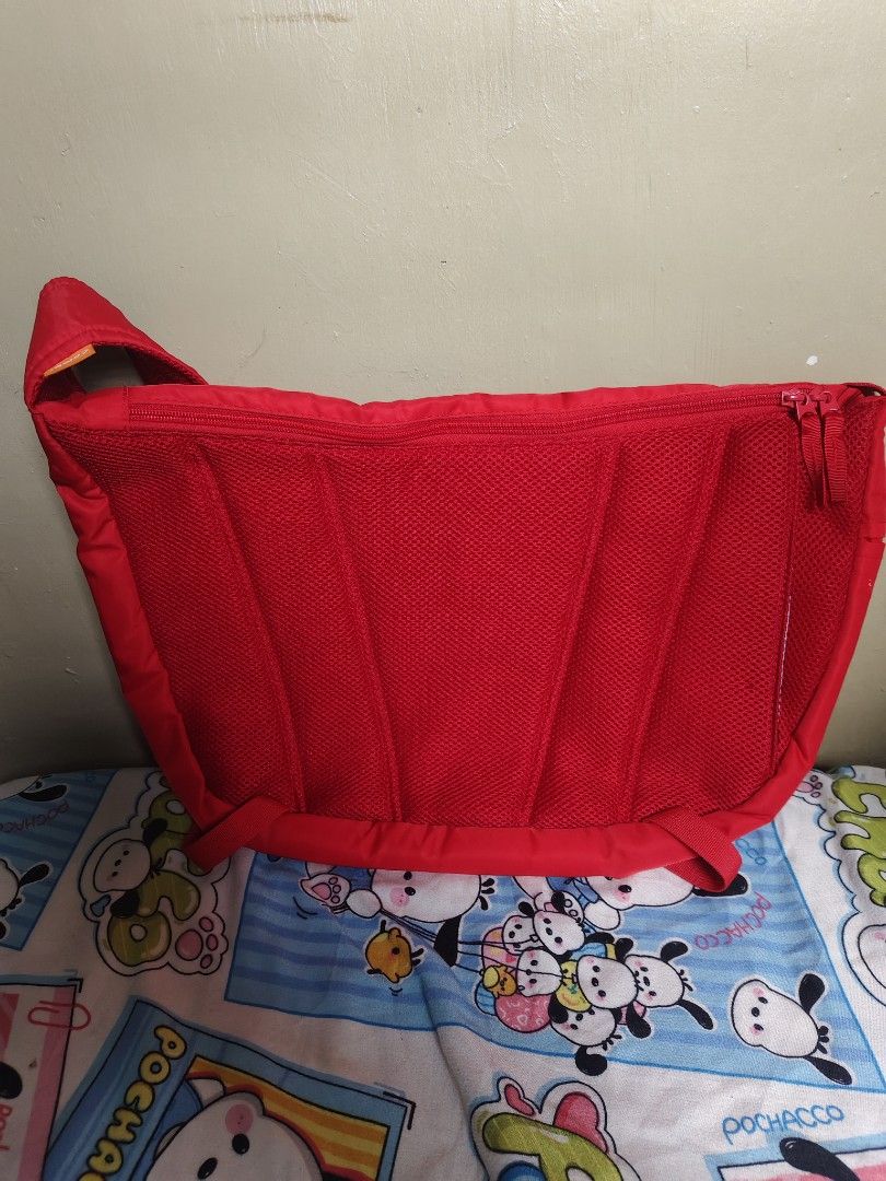 Combi Red Baby Diaper Messenger Bag (Category: Diaper Bags & Wetbags) located in General Mariano Alvarez. Submitted by findsandmoreph (Listing ID 1468295257, Image 2). Description: - Brand: Combi - Color: Bright red with black flap pocket and grey interior lining - Storage: Roomy main compartment with multiple mesh organizers and slip pockets - Comfort: Adjustable shoulder strap with padded section and structured mesh back panel PWEDE DIN GYM BAG