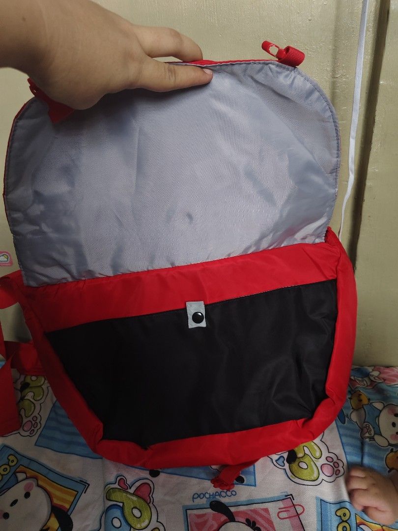Combi Red Baby Diaper Messenger Bag (Category: Diaper Bags & Wetbags) located in General Mariano Alvarez. Submitted by findsandmoreph (Listing ID 1468295257, Image 3). Description: - Brand: Combi - Color: Bright red with black flap pocket and grey interior lining - Storage: Roomy main compartment with multiple mesh organizers and slip pockets - Comfort: Adjustable shoulder strap with padded section and structured mesh back panel PWEDE DIN GYM BAG