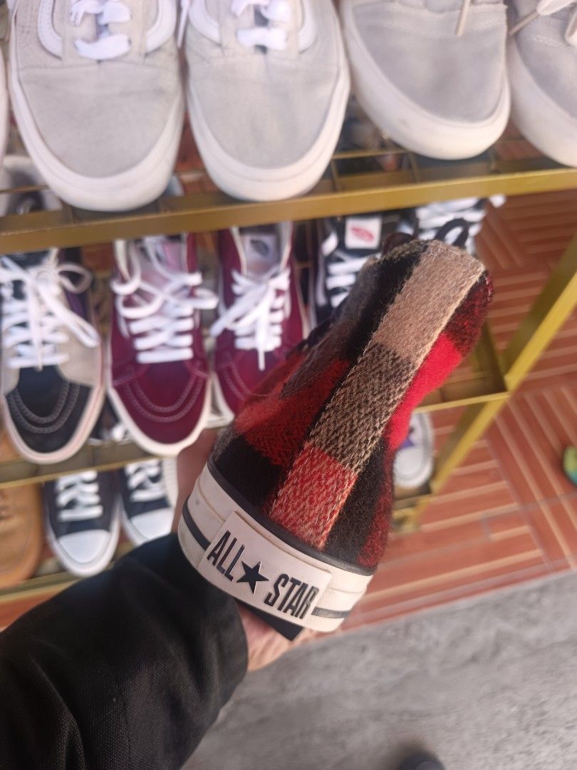 Converse Chuck Taylor Woolrich Buffalo Plaid High Top (Category: Sneakers) located in Santiago. Submitted by PjThrift (Listing ID 1468358607, Image 2). Description: - Brand: Converse x Woolrich collaboration - Style: High top sneakers - Pattern: Red and black wool plaid - Details: Brown laces, metal eyelets, white rubber toe cap and midsole, classic All Star heel license plate - Interior: Features official Woolrich fabric tag - Condition: [Insert