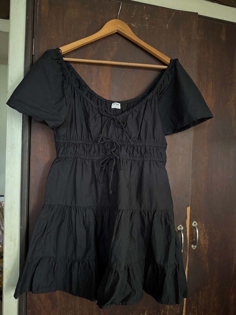 Cotton On Black Tiered Mini Dress (Category: Dresses) located in Quezon City. Submitted by ahgashoppe (Listing ID 1468396571, Image 1). Description: - fits L to XL - Never worn - vv cutesy - Design: Tiered mini dress with short puff sleeves and ruffled hem - Fit: Elasticated neckline and waist with double front tie-up drawstrings - Fabric: Lightweight and breathable, perfect for warm days - Origin: Made in India - Condition: Excellent, ready to w