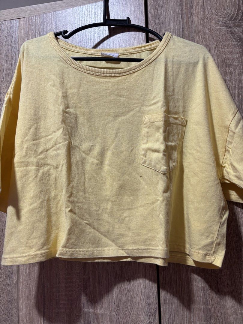 Cotton On Yellow Midrib Crop Top (Category: Sleeveless) located in Taal. Submitted by iampies08 (Listing ID 1468447413, Image 1). Description: - Brand: Cotton On - Color: Vibrant yellow - Style: Midrib crop top with relaxed fit - Details: Crew neck, short sleeves, and front left chest pocket - Perfect for: Sunny days, easy pairing with high-waisted jeans or shorts - Condition: Great casual basic, super comfy.