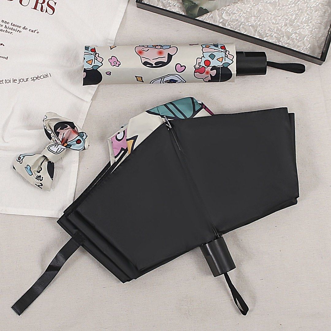 Crayon Shin-chan Foldable UV Sun Rain Umbrella (Category: Umbrellas) located in Guiguinto. Submitted by sheena4 (Listing ID 1468369584, Image 3). Description: - Adorable Crayon Shin-chan and Shiro all-over print design - Compact and foldable for easy daily carry - Black inner lining offers reliable sun and UV protection - Sturdy black handle for a comfortable grip - Comes with a matching storage sleeve - Great for both rainy and sunny days.
