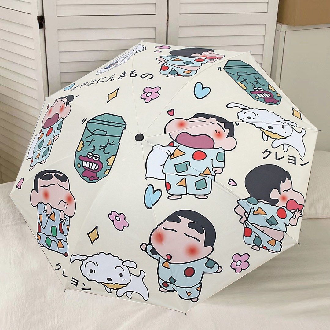 Crayon Shin-chan Foldable UV Sun Rain Umbrella (Category: Umbrellas) located in Guiguinto. Submitted by sheena4 (Listing ID 1468369584, Image 2). Description: - Adorable Crayon Shin-chan and Shiro all-over print design - Compact and foldable for easy daily carry - Black inner lining offers reliable sun and UV protection - Sturdy black handle for a comfortable grip - Comes with a matching storage sleeve - Great for both rainy and sunny days.