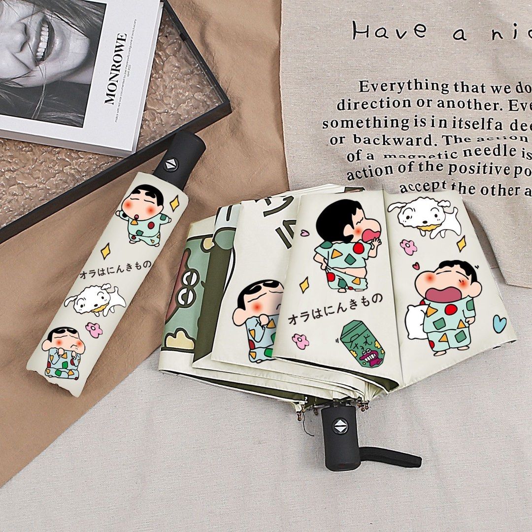 Crayon Shin-chan Foldable UV Sun Rain Umbrella (Category: Umbrellas) located in Guiguinto. Submitted by sheena4 (Listing ID 1468369584, Image 1). Description: - Adorable Crayon Shin-chan and Shiro all-over print design - Compact and foldable for easy daily carry - Black inner lining offers reliable sun and UV protection - Sturdy black handle for a comfortable grip - Comes with a matching storage sleeve - Great for both rainy and sunny days.