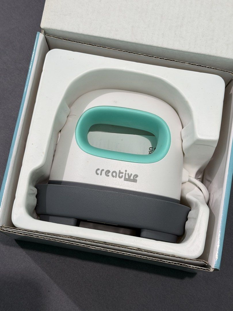 Creative Express CR06 Mini Easy Heat Press (Category: Craft Supplies & Tools) located in Quezon City. Submitted by jpfinds (Listing ID 1468435654, Image 1). Description: - Model: Creative Express CR06 Mini Easy Heat Press - Color: White and Teal - Ideal for: Small DIY craft projects such as custom shirts, hats, and tote bags - Features: Compact size, fast heat-up, and easy vinyl transfers - Inclusions: Original safety base and complete box packag