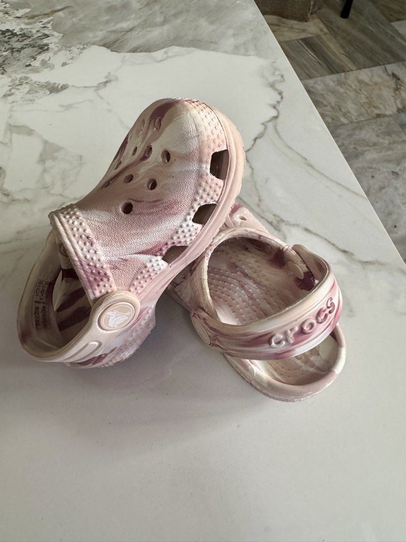 Crocs Classic Marbled Clogs Pink White Size C6 (Category: Babies & Kids Fashion) located in Pasig City. Submitted by gaylepacs (Listing ID 1468284394, Image 2). Description: - Item: Pink and white marbled Crocs clogs - Size: C6 - Condition: Moderate wear on bottom treads with some staining underneath, still has plenty of life left - Best for: Everyday wear, playground trips, and casual outings RFS: Outgrown Shipping c/o buyer Location: Pasig.