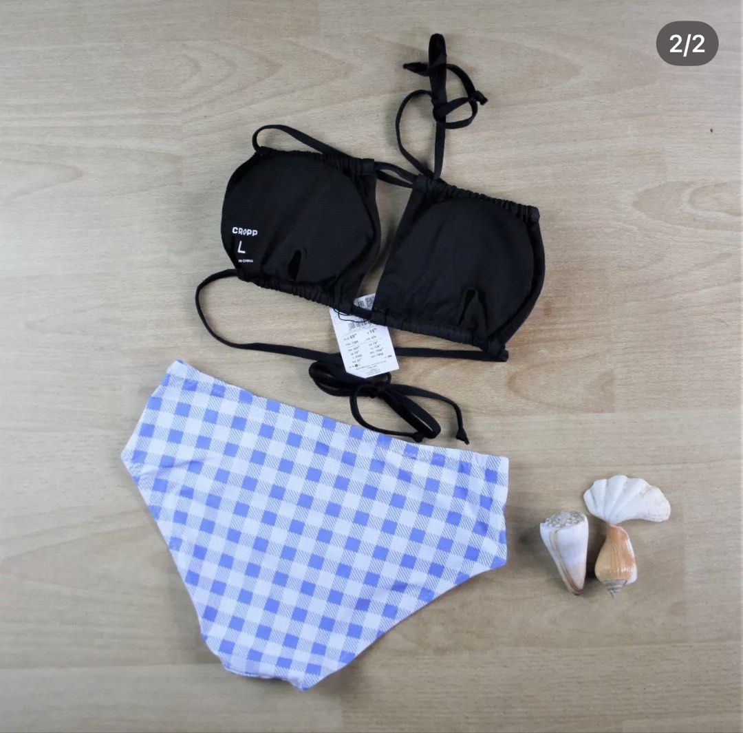 Cropp Black and Blue Gingham Bikini Set Size L (Category: Bikinis & Swimsuits) located in Bulacan. Submitted by peach1025 (Listing ID 1468499561, Image 2). Description: - Brand: Cropp - Condition: Brand new with original tags attached (unworn) - Size: L - Top: Black halter style - Bottoms: Purple and white gingham, high-waisted - Perfect for summer, pool parties, and beach getaways.