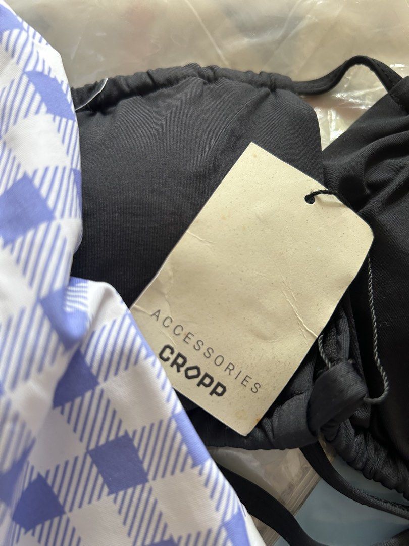 Cropp Black and Blue Gingham Bikini Set Size L (Category: Bikinis & Swimsuits) located in Bulacan. Submitted by peach1025 (Listing ID 1468499561, Image 3). Description: - Brand: Cropp - Condition: Brand new with original tags attached (unworn) - Size: L - Top: Black halter style - Bottoms: Purple and white gingham, high-waisted - Perfect for summer, pool parties, and beach getaways.