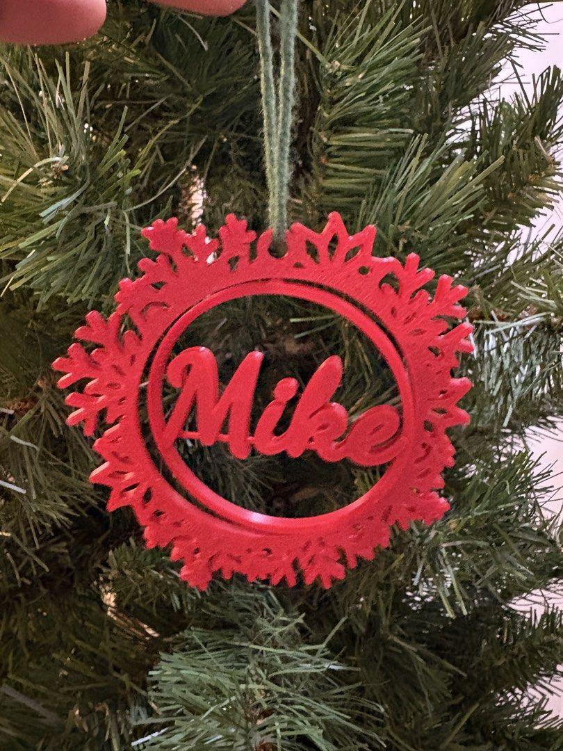 Custom 3D printed snowflake name Christmas tree ornament decoration (Category: Handmade Craft) located in Paranaque City. Submitted by sqt_closet (Listing ID 1468484915, Image 2). Description: - 3D-printed custom snowflake ornament with a circular frame holding a name - (Message us for custom requests!) - Color combinations: All-white, all-red, or white frame with a red name - Perfect personalized gift or holiday decor for your home P45 each 3 fo