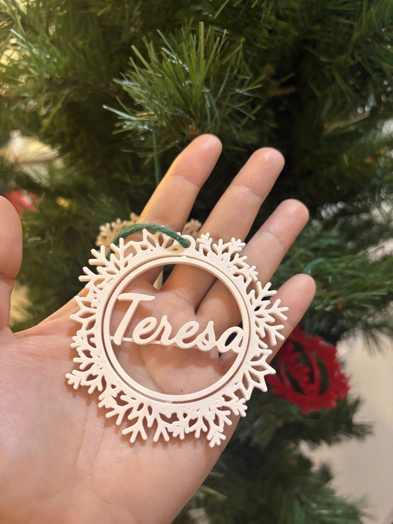 Custom 3D printed snowflake name Christmas tree ornament decoration (Category: Handmade Craft) located in Paranaque City. Submitted by sqt_closet (Listing ID 1468484915, Image 1). Description: - 3D-printed custom snowflake ornament with a circular frame holding a name - (Message us for custom requests!) - Color combinations: All-white, all-red, or white frame with a red name - Perfect personalized gift or holiday decor for your home P45 each 3 fo