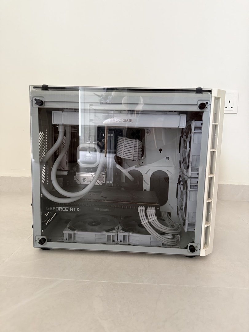 Custom White Gaming PC with Corsair Case and Liquid Cooling (Category: Desktops) located in Singapore. Submitted by pickaloot (Listing ID 1468320663, Image 2). Description: - Stunning white custom gaming rig in a dual-chamber glass panel case - SSD 512GB, HDD 3TB - Equipped with a reliable Corsair liquid CPU cooler for optimal temperatures - Powered by a high-performance Zotac RTX 2070 Super graphics card - Pristine cable management with clean br