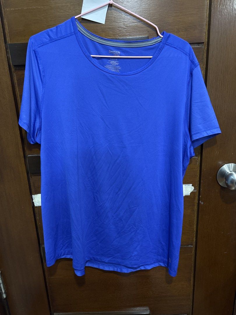 Danskin Now Blue Active T-Shirt XL (Category: Tshirts & Polo Shirts ) located in Mandaluyong City. Submitted by clothescarousel (Listing ID 1468441175, Image 1). Description: - Brand/Model: Danskin Now Athletic Top - Color: Royal Blue with grey inner neckline trim - Size: XL (16-18), Semi-fitted cut - Material: Lightweight, stretchy performance fabric - Features: Quick-drying, easy to wash - Best For: Workouts, running, or everyday casual wear.