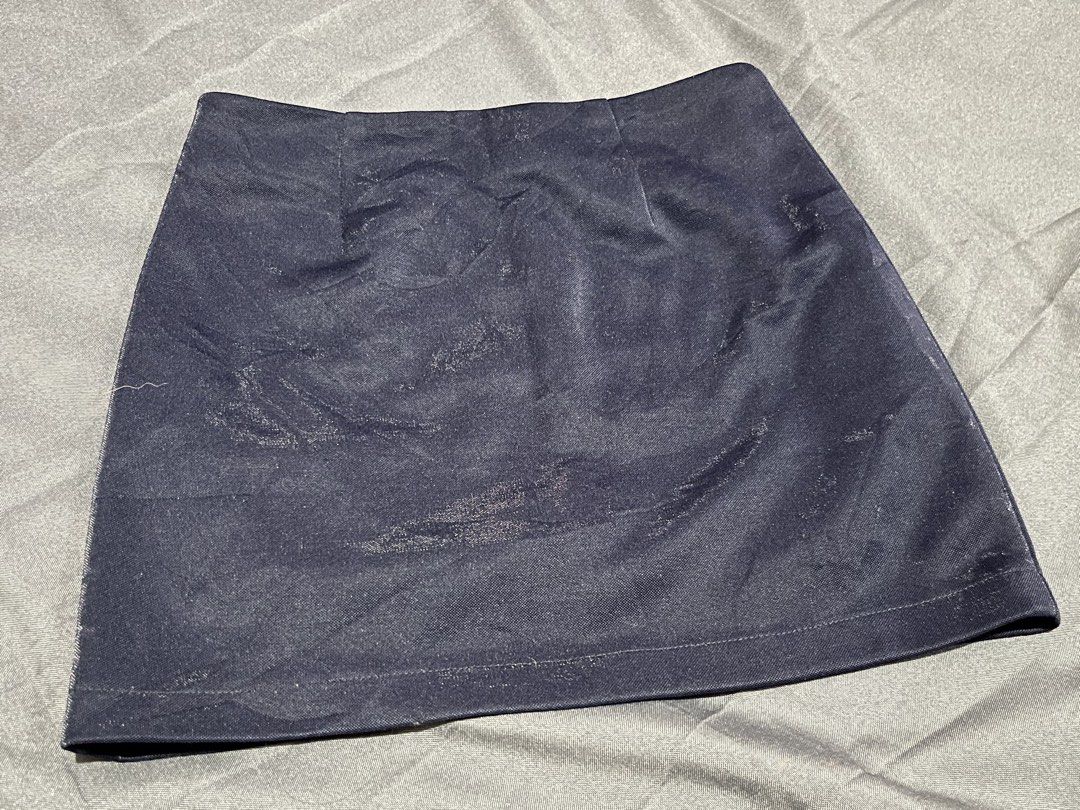 Dark blue denim mini skirt (Category: Skirts) located in Quezon City. Submitted by ayapiaya (Listing ID 1468317215, Image 1). Description: - Color: Dark blue - Style: Fitted denim mini skirt - Closure: Hidden back zipper - Hem: Clean bottom finish - Versatile piece, great for pairing with basic tees and casual tops Issue: punit yung inner fabric (double lining), pwede tanggalin.