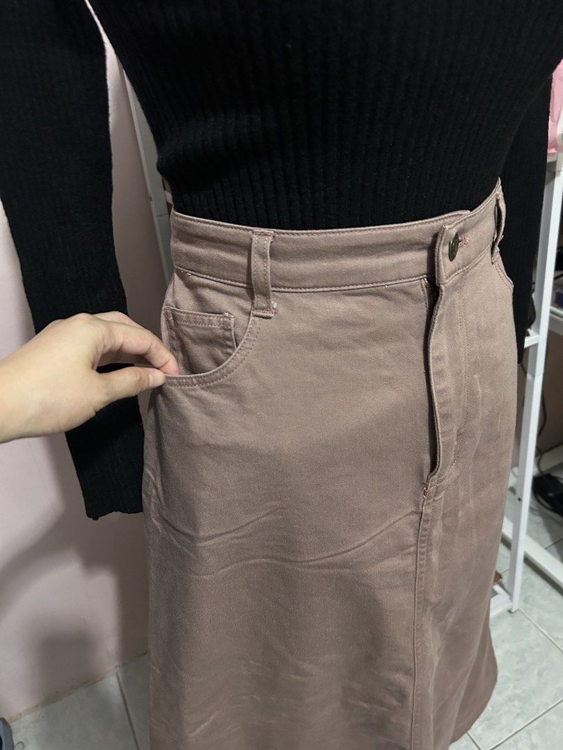 Mauve midi skirt with front pockets and buttons (Category: Skirts) located in Makati City. Submitted by aizy_sell (Listing ID 1468356305, Image 3). Description: - Color: dark pink to dark purplish - Length: Midi - Material: Sturdy, durable cotton - Fit: High waist with a straight silhouette - Closure: Front button closure with belt loops - Pockets: Handy front curved pockets and back patch pockets - Style: Clean stitching details, great versatile