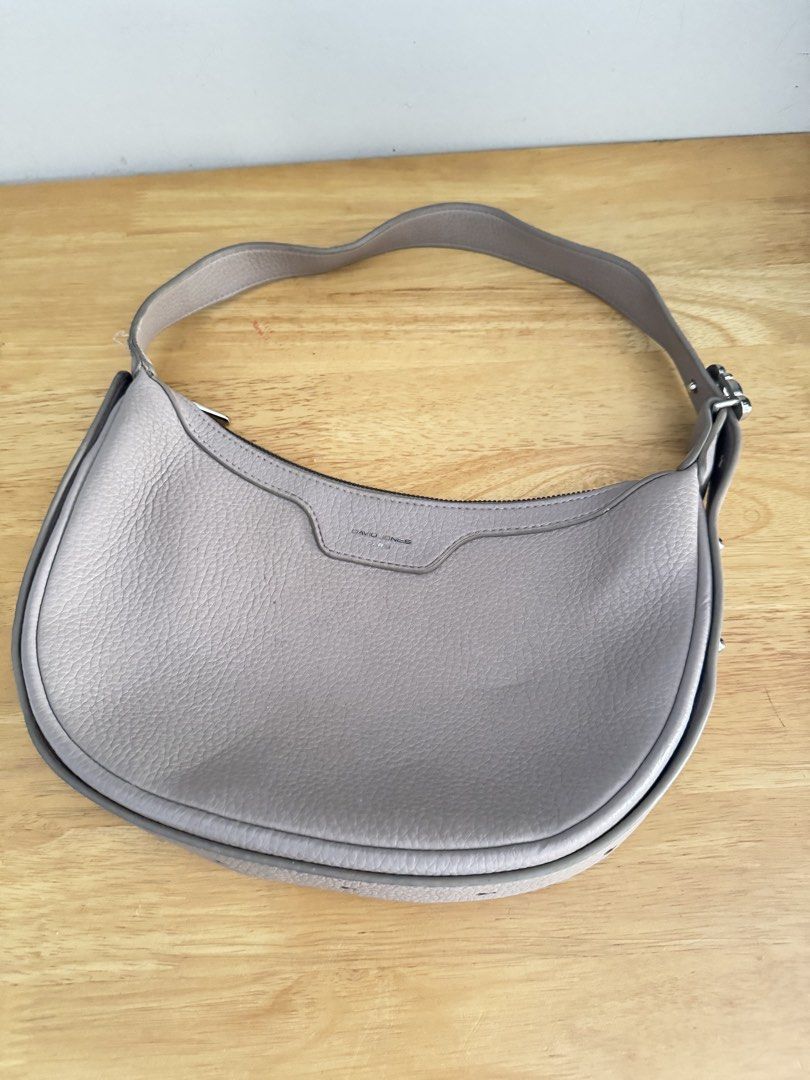 David Jones Paris Grey Bag Adjustable Strap (Category: Shoulder Bags) located in Mandaluyong City. Submitted by uol77 (Listing ID 1468304862, Image 1). Description: - Brand: David Jones Paris - Material: Grey pebbled faux leather - Closure: Zip top with silver-tone hardware - Strap: Adjustable with decorative metal buckle - Interior: Lined with 1 zipped pocket and slip pockets - Condition: Clean inside and out.
