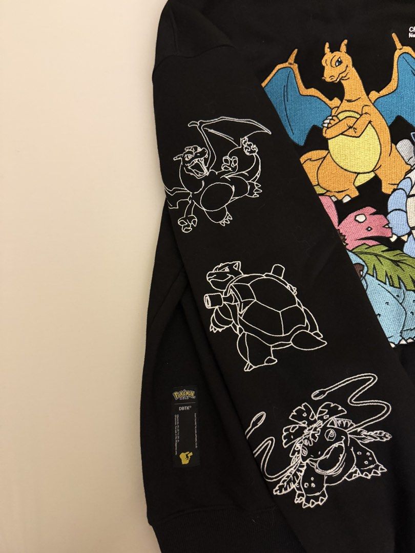 DBTK x Pokemon Black Hoodie (Category: Coats, Jackets and Outerwear) located in Pasig City. Submitted by nimskee (Listing ID 1468464208, Image 3). Description: •Official DBTK x Pokemon collaboration black pullover hoodie. •Premium heavyweight cotton fleece with cozy kangaroo pocket and drawstring hood. •Fully embroidered Charizard, Blastoise, and Venusaur graphics with Pokedex numbers on the back. •Final evolution line art printed on one sleeve a