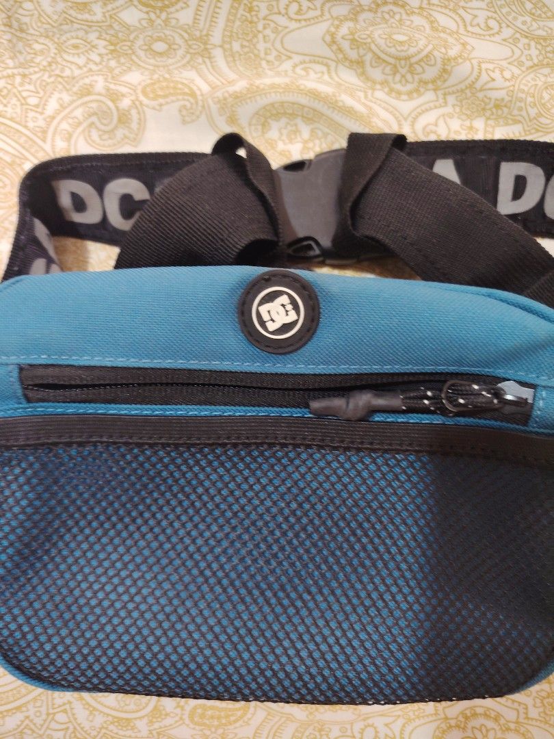 DC Waist Bag or Sling (Category: Belt bags, Clutches and Pouches) located in Antipolo. Submitted by gmariola101 (Listing ID 1468305903, Image 2). Description: - Authentic DC Shoes waist bags (Comes with Blue and Grey) - Adjustable black strap with DC logo branding - Convenient front mesh pocket and zippered main compartment - Internal tags attached - Ideal for daily use and keeping essentials handy.