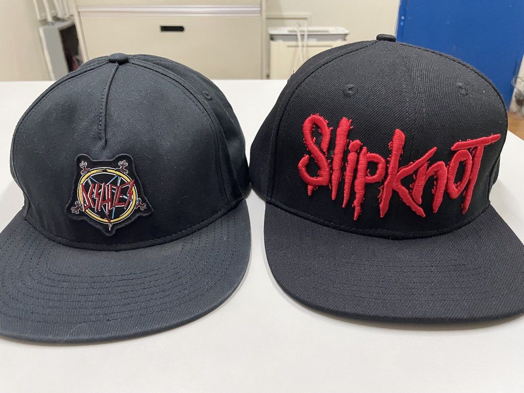 DC x Slayer / Slipknot Snapback Hat Bundle (Category: Caps & Hats) located in Manila. Submitted by kristinamaria (Listing ID 1468298142, Image 1). Description: - Set of 2 metal snapback caps - Cap 1: DC Shoes x Slayer collab patch on the front with Slayer embroidered on the back - Cap 2: Bold red Slipknot embroidered lettering on the front panel - Adjustable plastic strapback closure for a customizable fit - Great for daily wear, concerts, and me