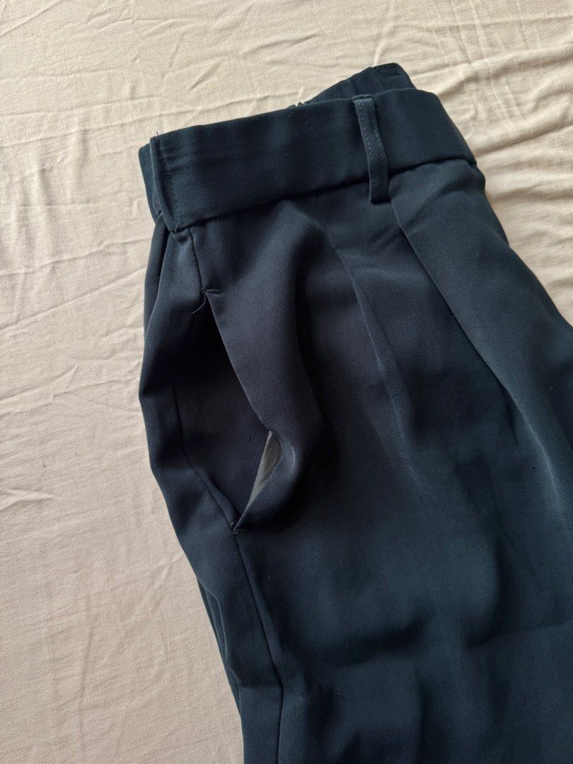 Deep green trouser size 27-30 garterized back (Category: Other Bottoms) located in Mandaluyong City. Submitted by uol77 (Listing ID 1468330337, Image 1). Description: - Color: deep green - Style: Tailored trousers with a pleated front -32 inches in length - Waist: High-waisted with a half elastic band at the back for comfort - Features: Deep side pockets - Fabric: Smooth with a slight drape - Versatility: Ideal for office wear or smart casual dai